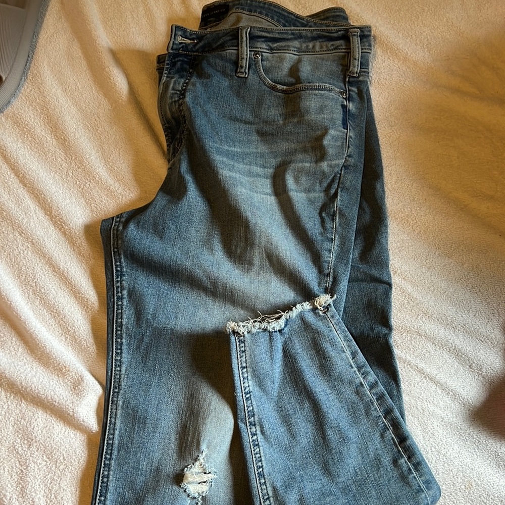 Distressed blue jeans by silver jean company